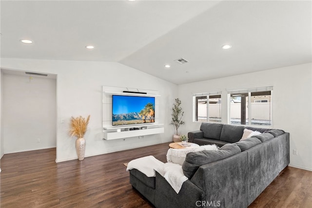 living room featuring dark wood-type flooring and vaulted ceiling