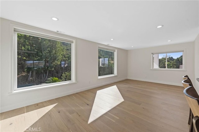 unfurnished living room with light hardwood / wood-style flooring