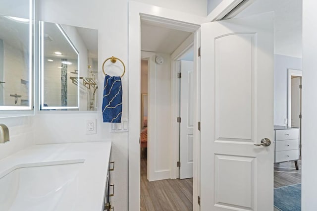 bathroom featuring wood-type flooring and vanity