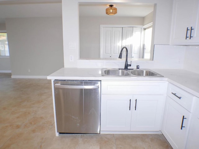 kitchen with sink, white cabinetry, dishwasher, light tile patterned floors, and kitchen peninsula