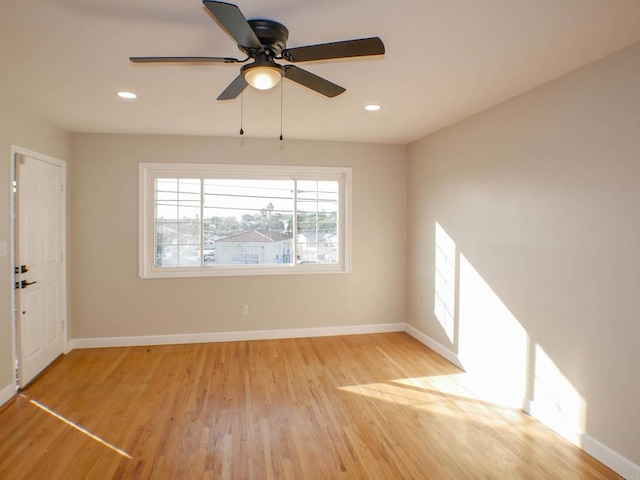 empty room featuring light hardwood / wood-style floors and ceiling fan