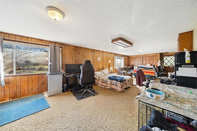 carpeted office featuring wood walls