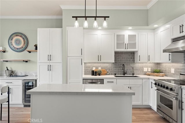 kitchen featuring high end range, open shelves, ornamental molding, a sink, and wine cooler