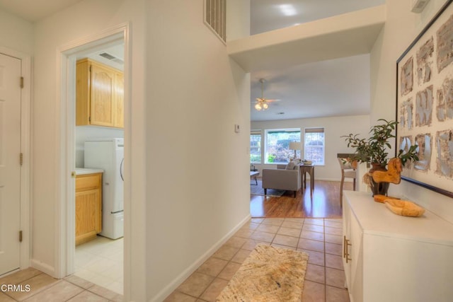 hallway featuring light tile patterned floors