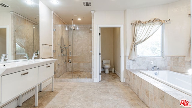 full bathroom with shower with separate bathtub, vanity, and toilet