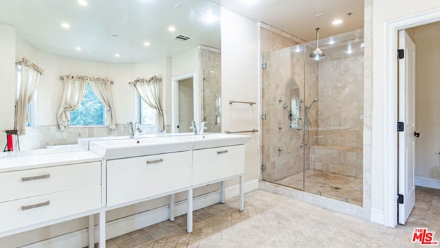 bathroom with vanity and walk in shower