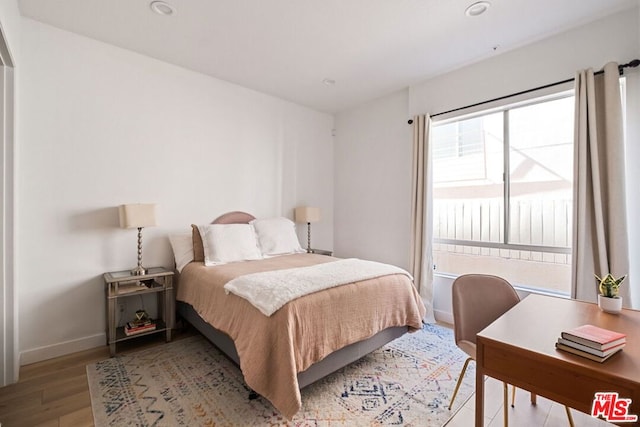 bedroom with light wood-type flooring