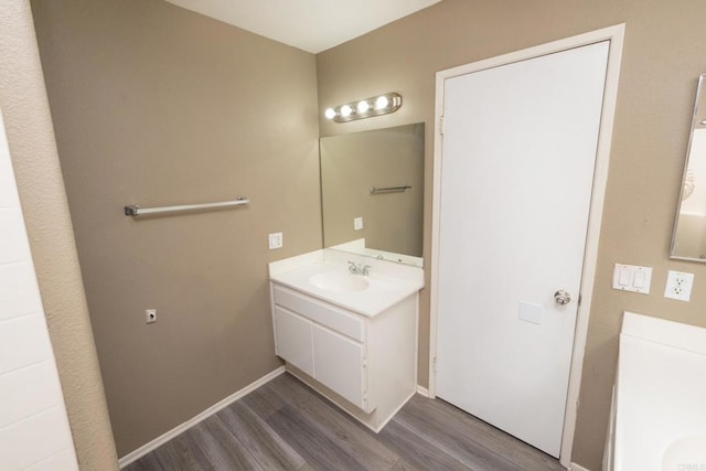 bathroom featuring wood-type flooring and vanity