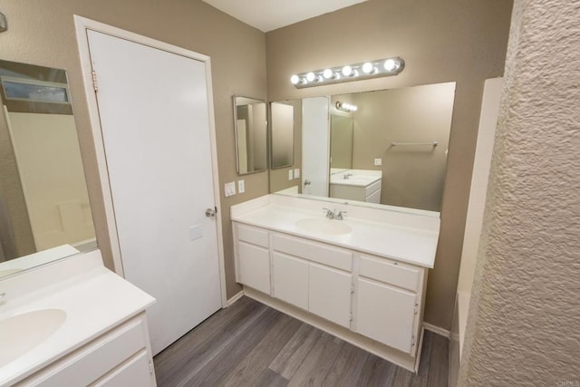 bathroom with wood-type flooring and vanity