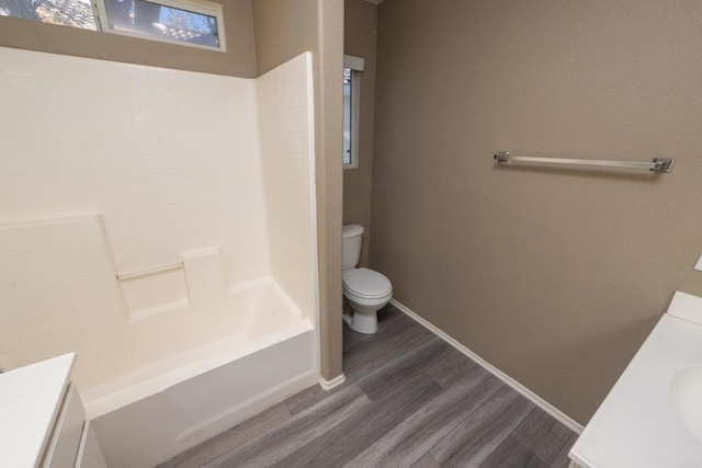 full bathroom with toilet, shower / bathtub combination, wood-type flooring, and vanity