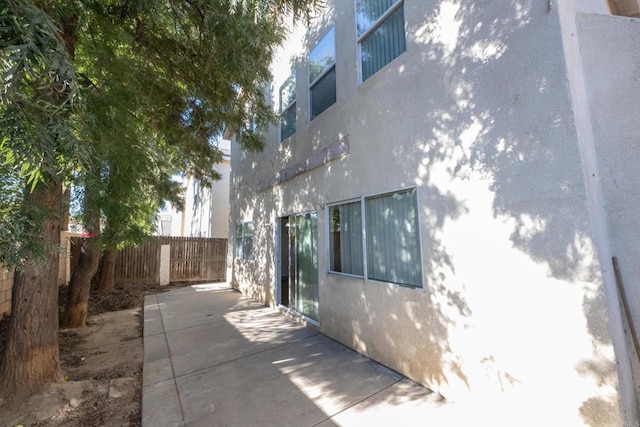 view of side of home featuring a patio area