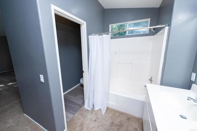 full bathroom with sink, shower / bath combination with curtain, lofted ceiling, and toilet