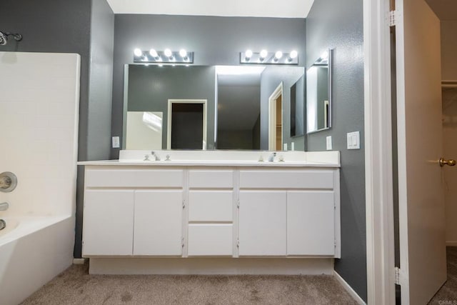 bathroom featuring vanity and  shower combination