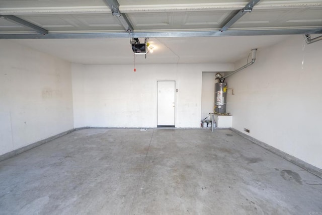 garage with a garage door opener and water heater