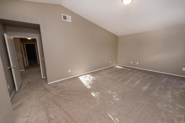 interior space with vaulted ceiling and carpet flooring