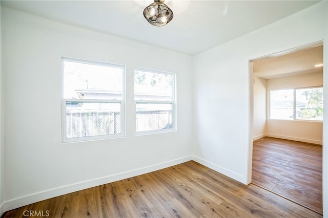 spare room featuring hardwood / wood-style floors