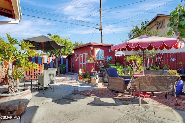 view of patio featuring an outbuilding