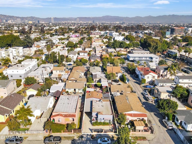 birds eye view of property with a mountain view