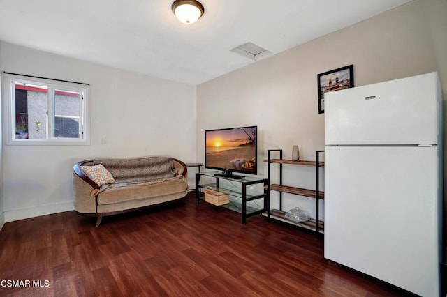 living area featuring dark wood-type flooring