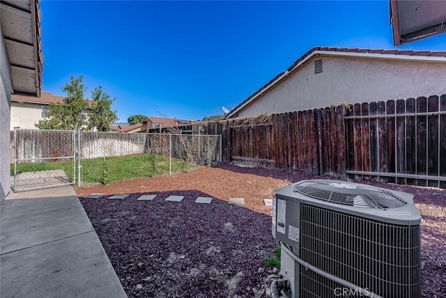 view of yard featuring central air condition unit