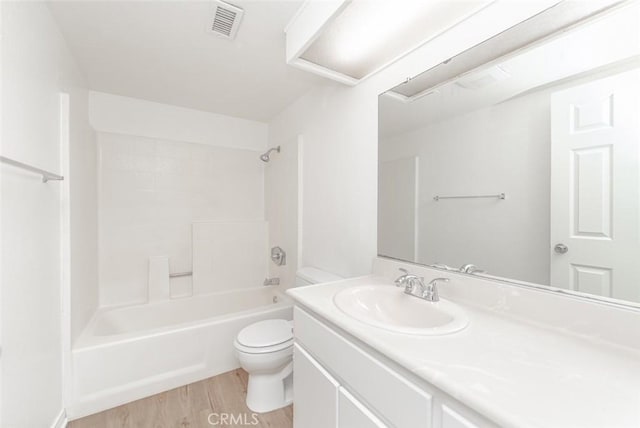 full bathroom with toilet, vanity, hardwood / wood-style floors, and  shower combination