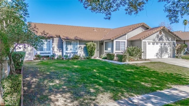 view of front of house with a garage and a front lawn