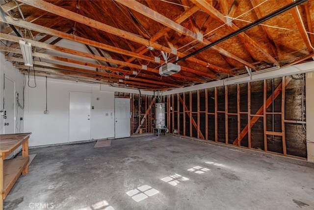 garage featuring water heater and a garage door opener