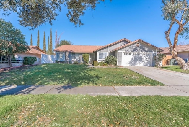 view of front facade featuring a front yard and a garage