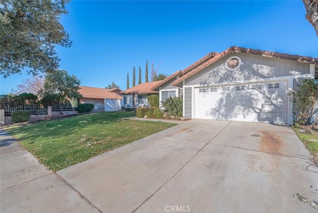 ranch-style home featuring a front lawn and a garage