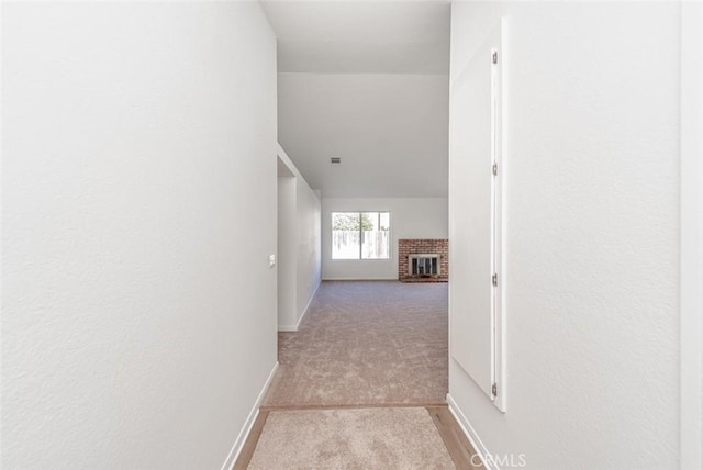 corridor with light colored carpet