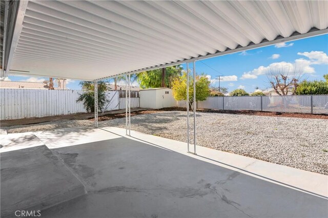 view of patio with a storage unit