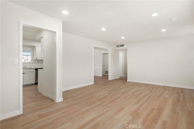 spare room with light wood-type flooring