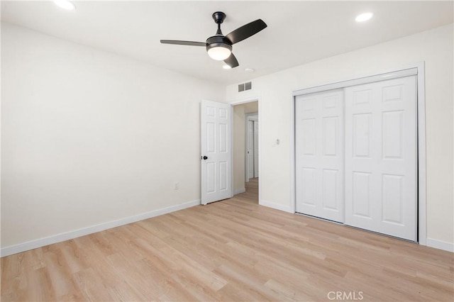 unfurnished bedroom featuring a closet, ceiling fan, and light hardwood / wood-style floors