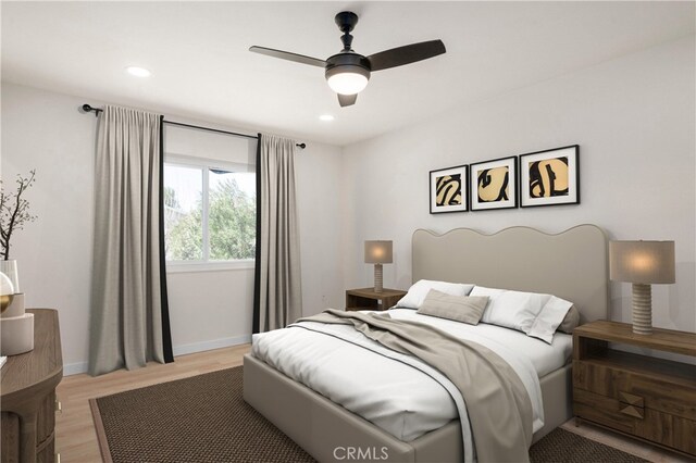 bedroom featuring ceiling fan and light hardwood / wood-style flooring