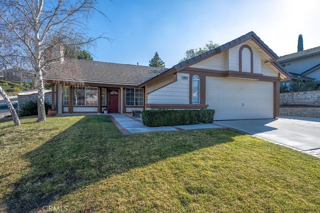 single story home featuring a front lawn and a garage