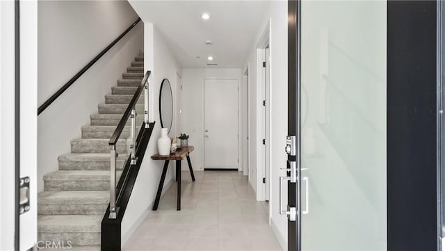 entryway with light tile patterned floors