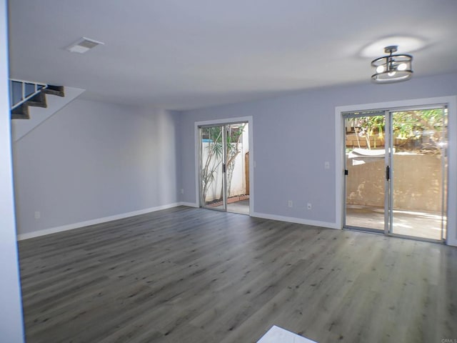 unfurnished living room featuring hardwood / wood-style floors