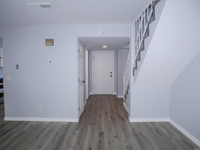 hall with light hardwood / wood-style floors