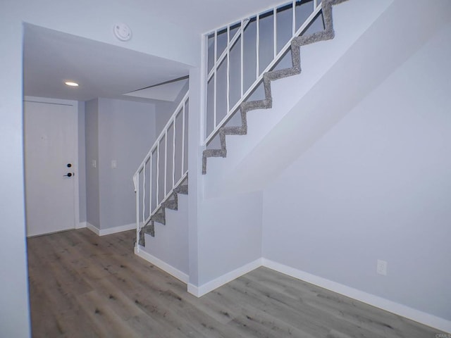 stairs with wood-type flooring