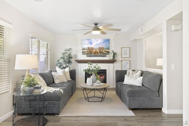 living room featuring hardwood / wood-style flooring and ceiling fan