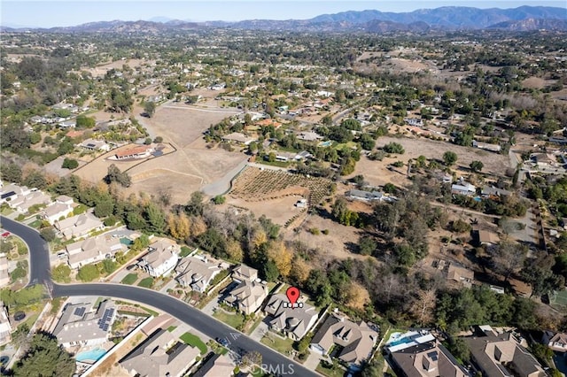 birds eye view of property featuring a mountain view