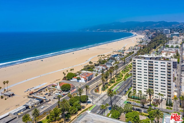 bird's eye view featuring a beach view and a water view