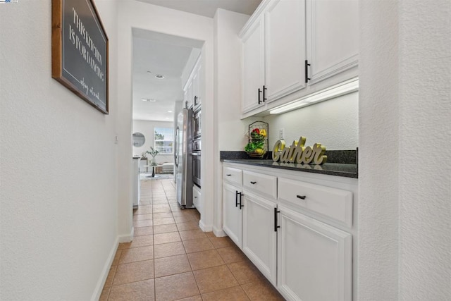 hallway featuring light tile patterned floors