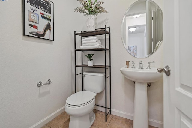 bathroom featuring toilet and tile patterned floors