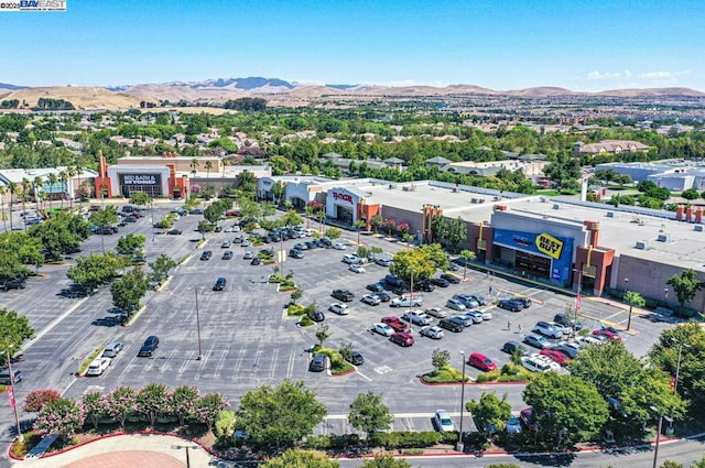 birds eye view of property with a mountain view