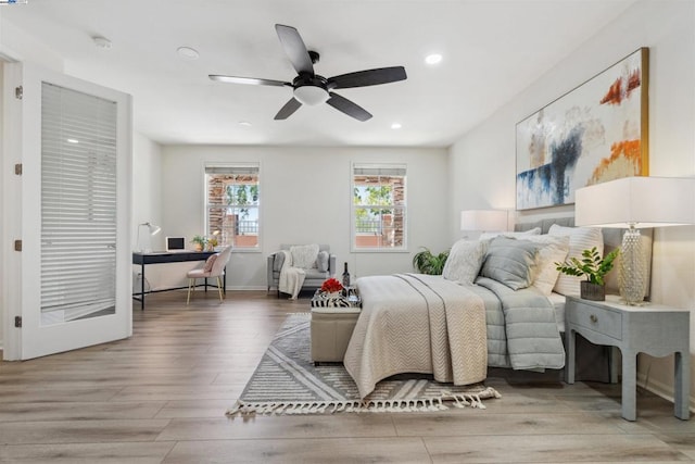 bedroom with ceiling fan and hardwood / wood-style floors