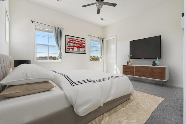 carpeted bedroom with ceiling fan