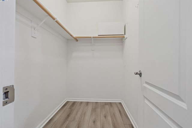 walk in closet featuring light wood-type flooring