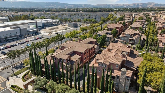 drone / aerial view featuring a mountain view