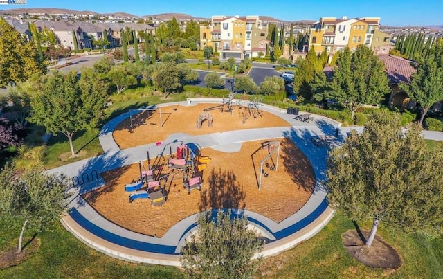 birds eye view of property with a mountain view